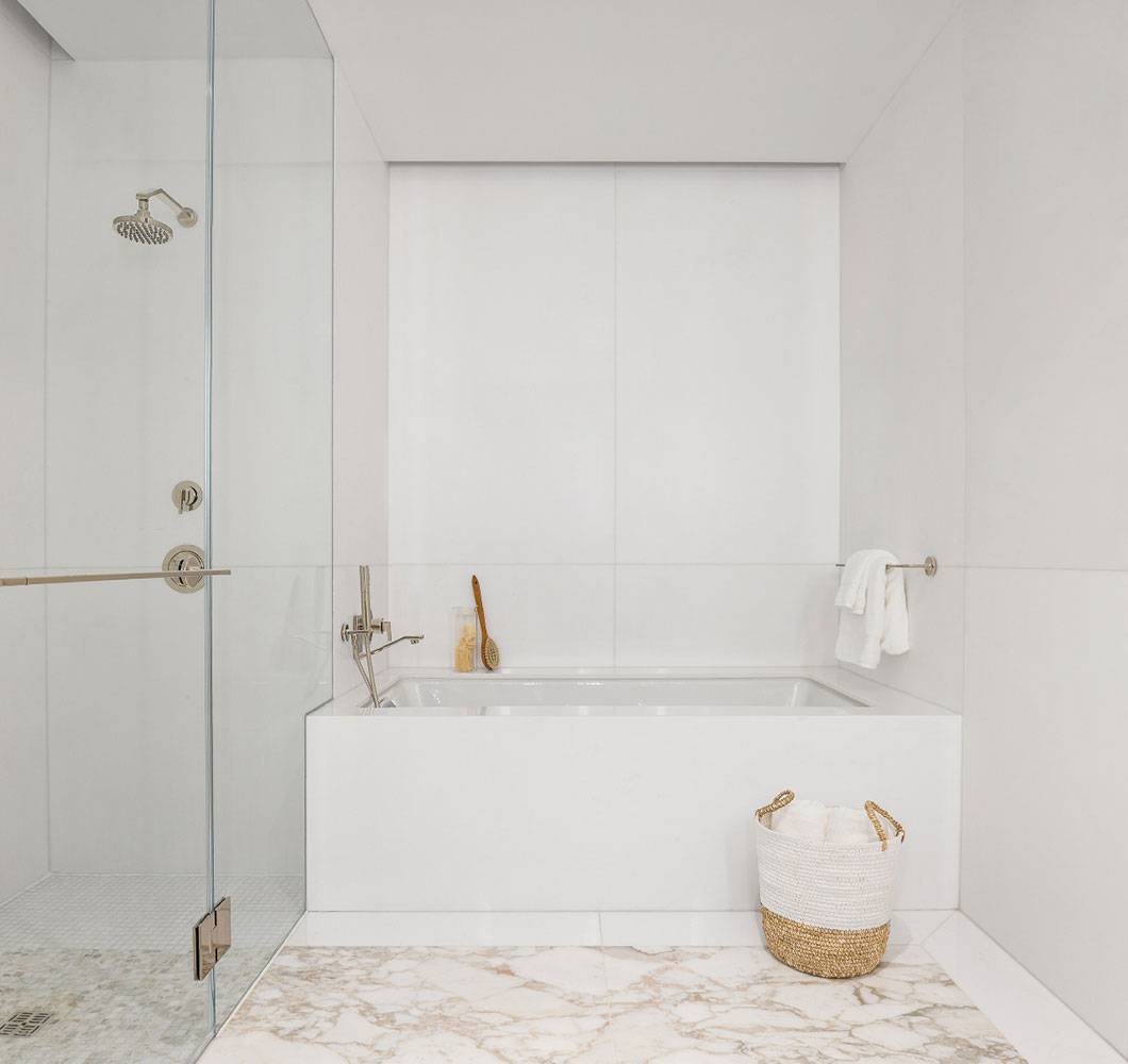 1289 Lexington bathroom with bathtub and glass shower.